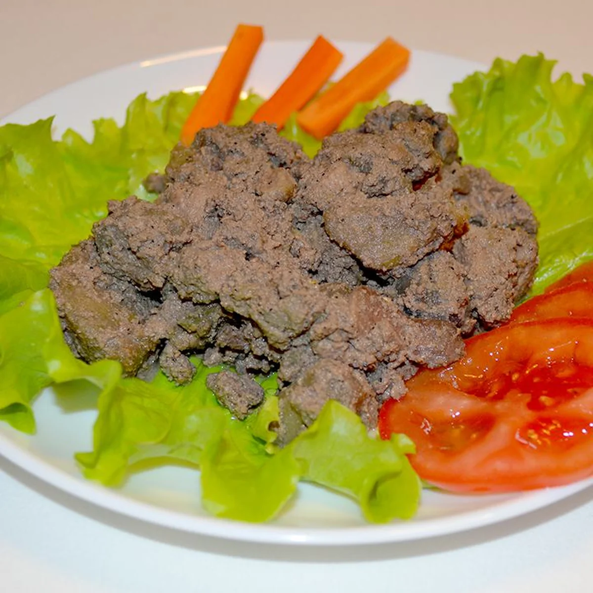 Тушёная печень с яблоками